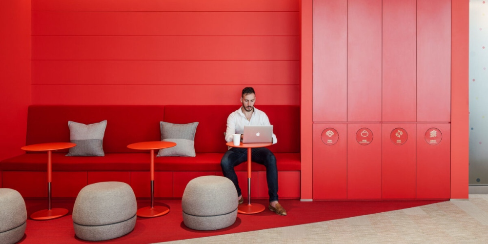 Open-concept PerForm workspace with natural light and modern desks
